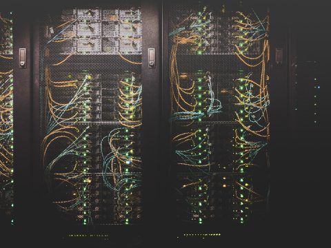 A server room filled with lots of wires and cables.