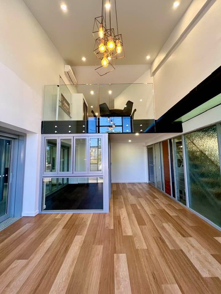 An Empty Room With Hardwood Floors — Datco Windows & Doors Pty Ltd In South Murwillumbah, NSW