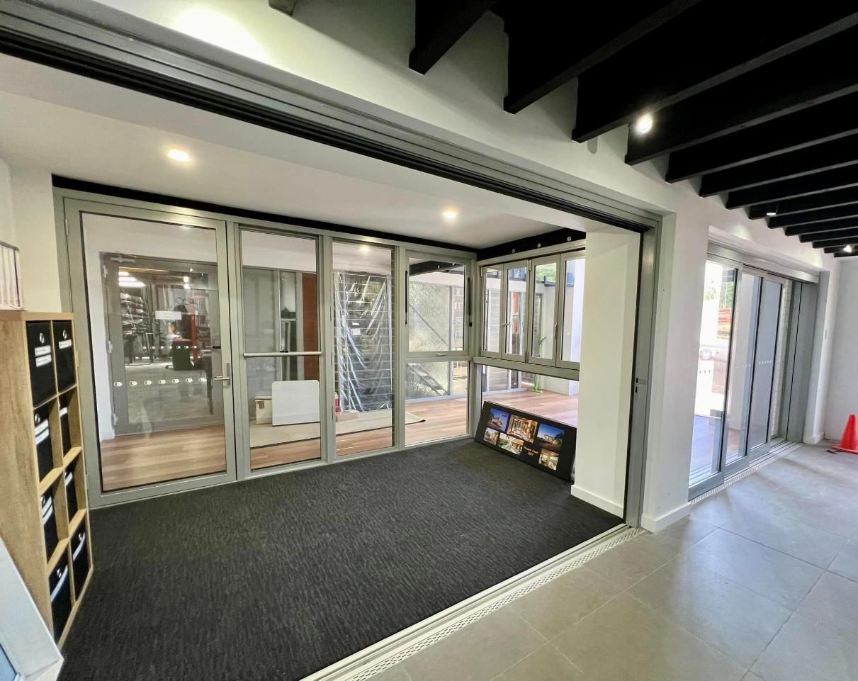 A Large Room With A Lot Of Windows And Doors — Datco Windows & Doors Pty Ltd In South Murwillumbah, NSW