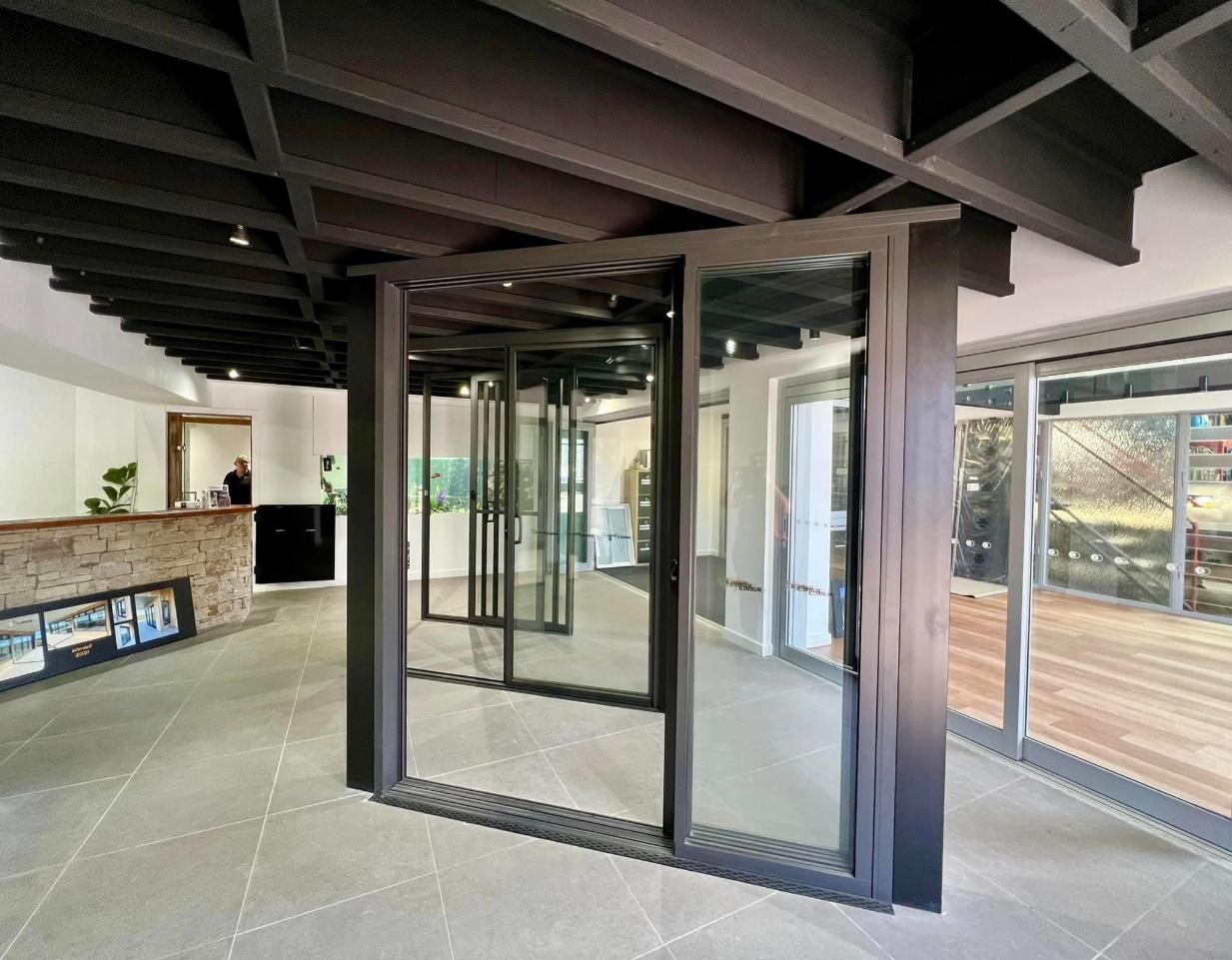 A Large Room With A Lot Of Windows And A Reception Desk — Datco Windows & Doors Pty Ltd In South Murwillumbah, NSW