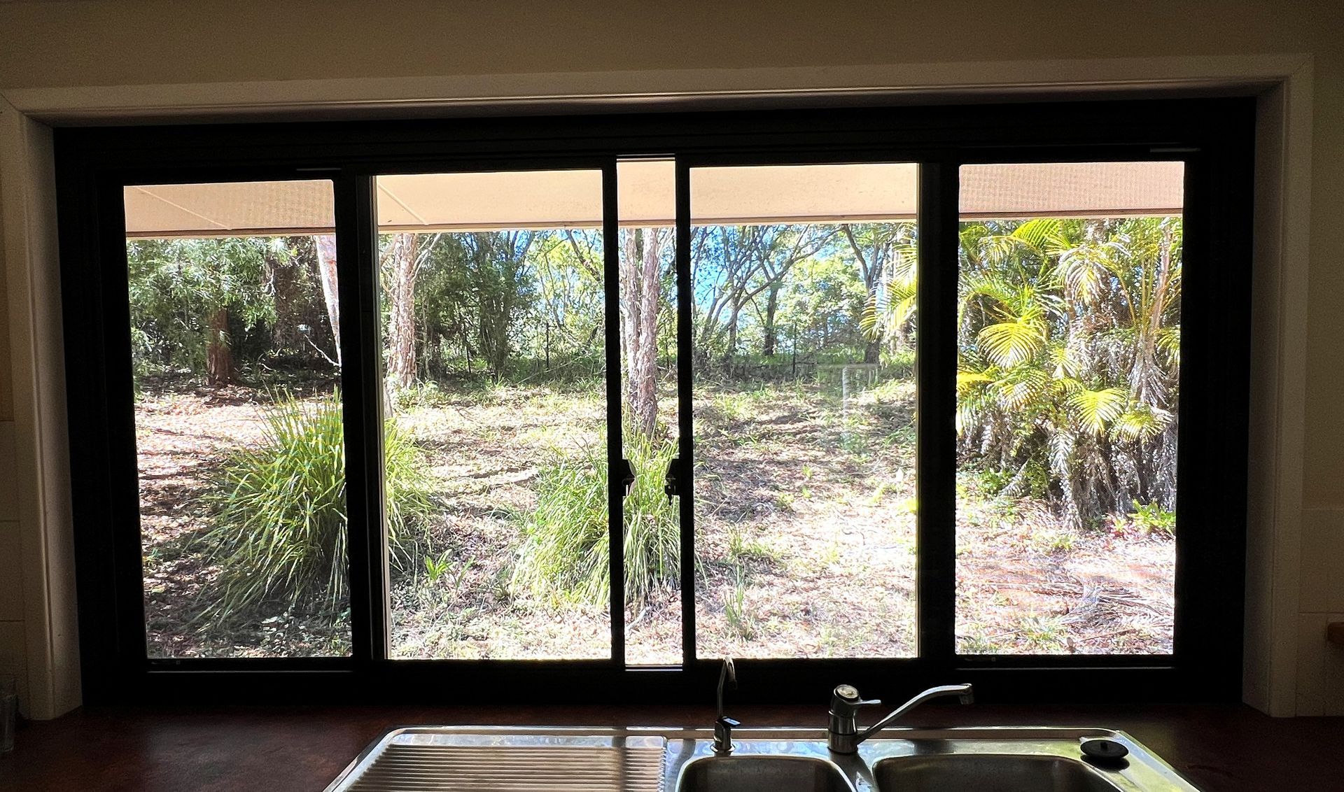 Sliding Glass Windows Overlooking a Wooded Area — Datco Windows & Doors Pty Ltd In South Murwillumbah, NSW