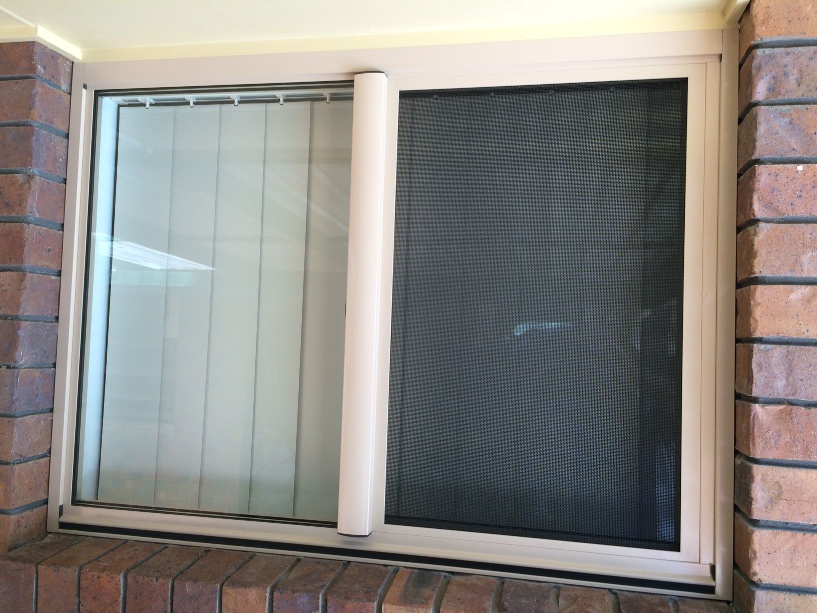 Sliding Window With Beige Frame and a Closed Screen — Datco Windows & Doors Pty Ltd In South Murwillumbah, NSW