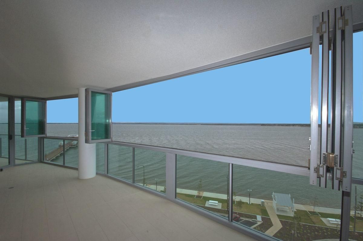 An Empty Room With A Balcony And A View Of The Ocean — Datco Windows & Doors Pty Ltd In South Murwillumbah, NSW
