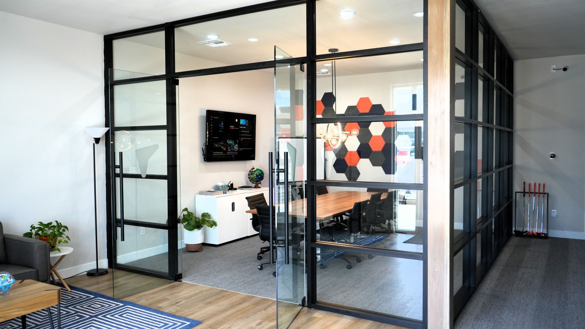 A conference room with a table and chairs in it.