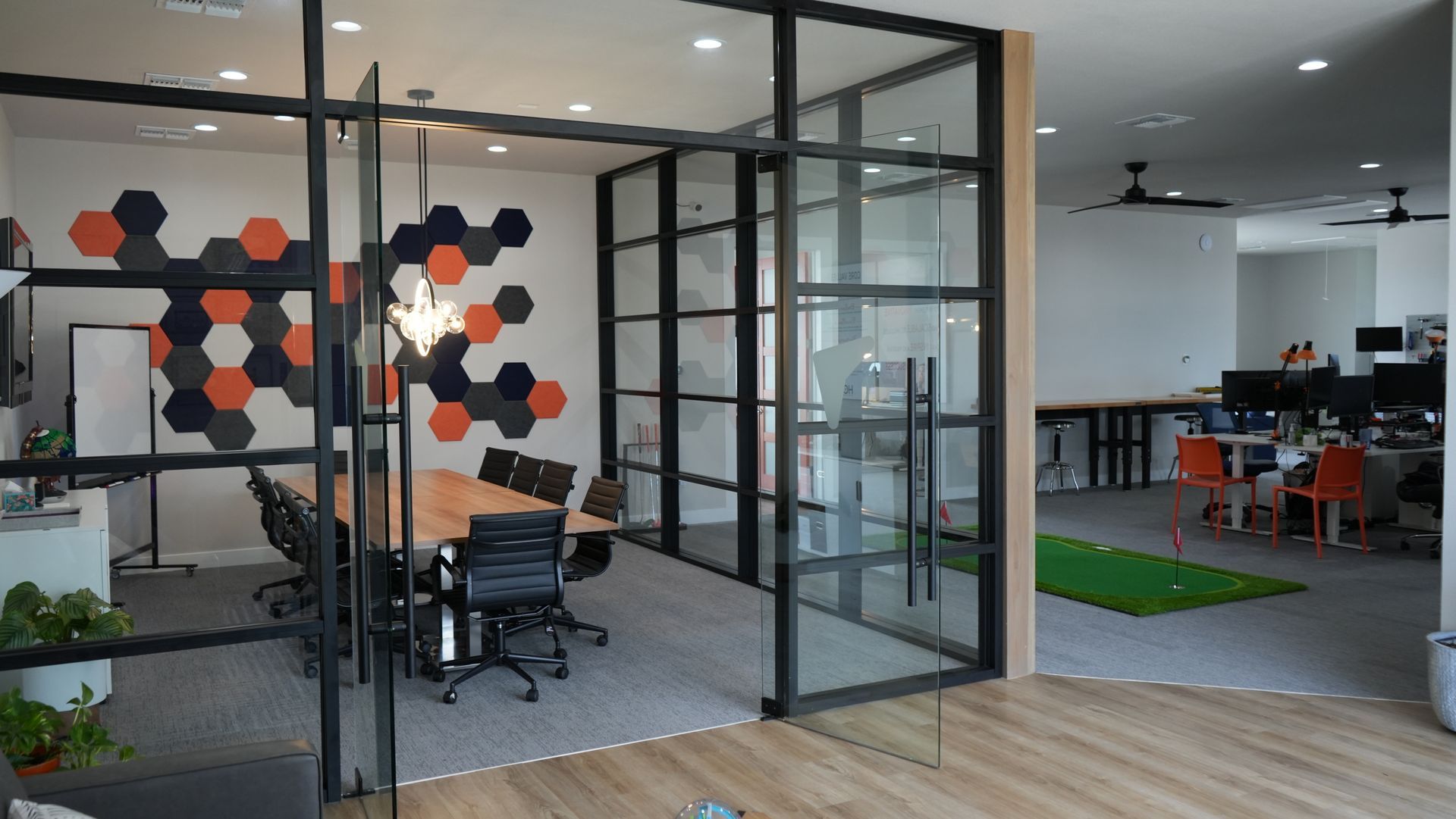 There is a conference room with a table and chairs in it.