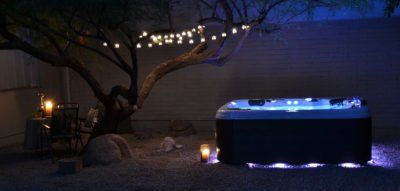 Woman on Hot Tub Smiling — Livonia, MI — Glenn’s Fireplace & Spa