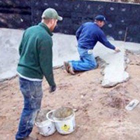 Men Leveling Cement — Kalamazoo, MI — Mark’s Pool Services LLC