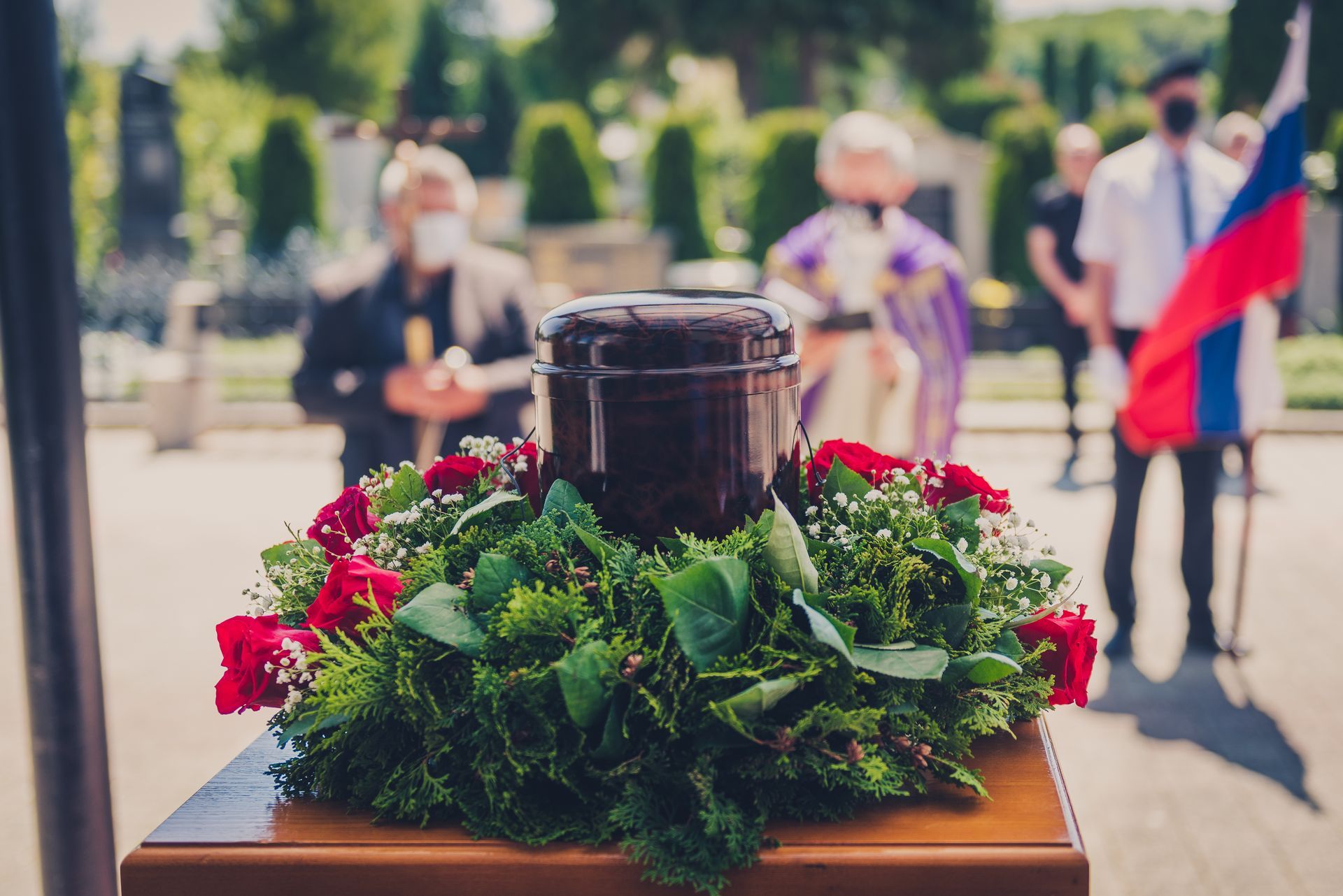 Urn with white roses