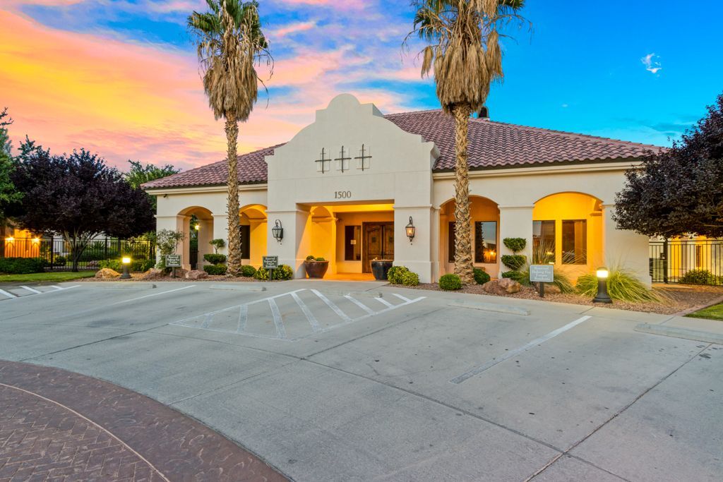 A large building with a parking lot in front of it