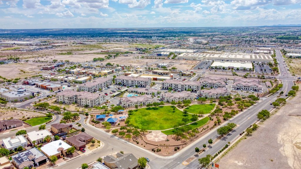An aerial view of a city with a park in the middle of it.