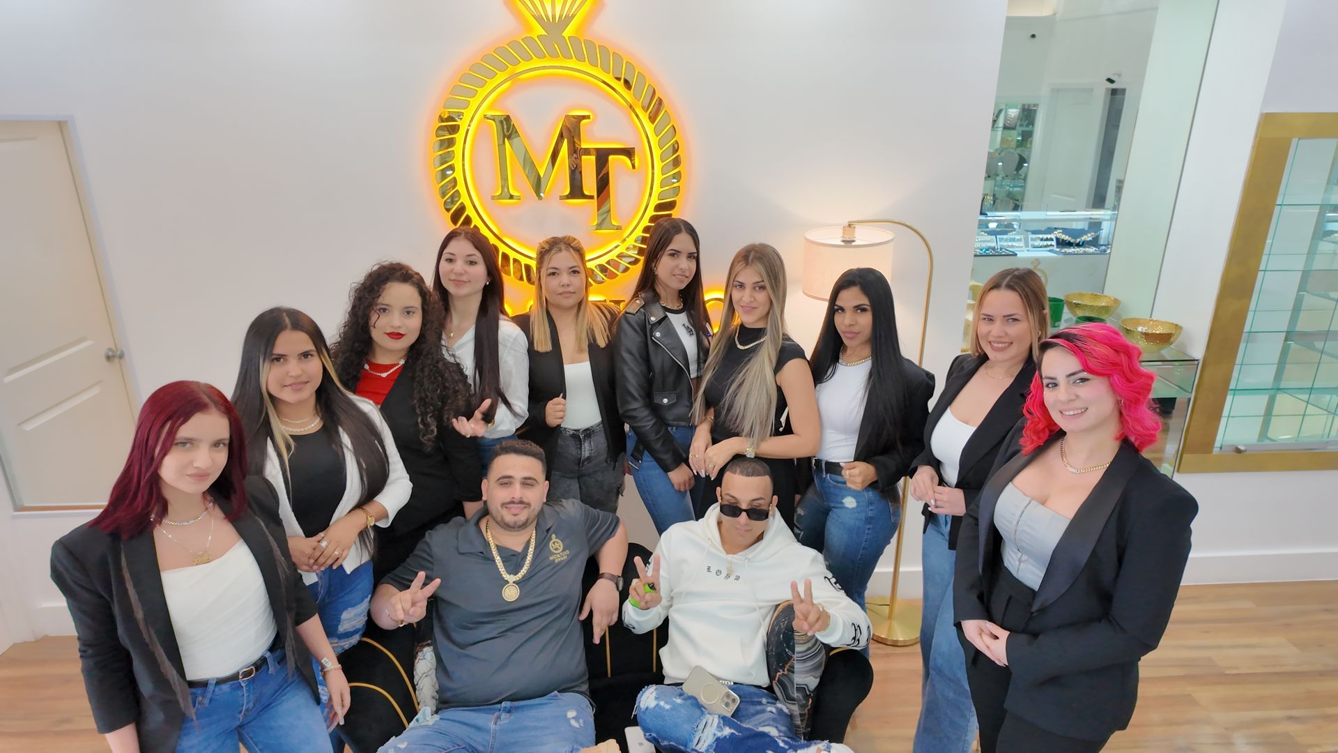 A group of people are posing for a picture in a room.