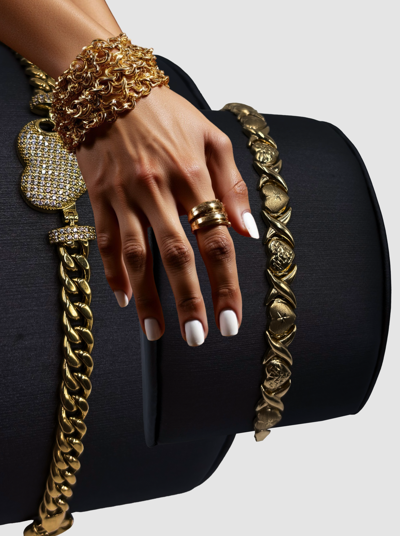 A woman 's hand with a ring and bracelets on it