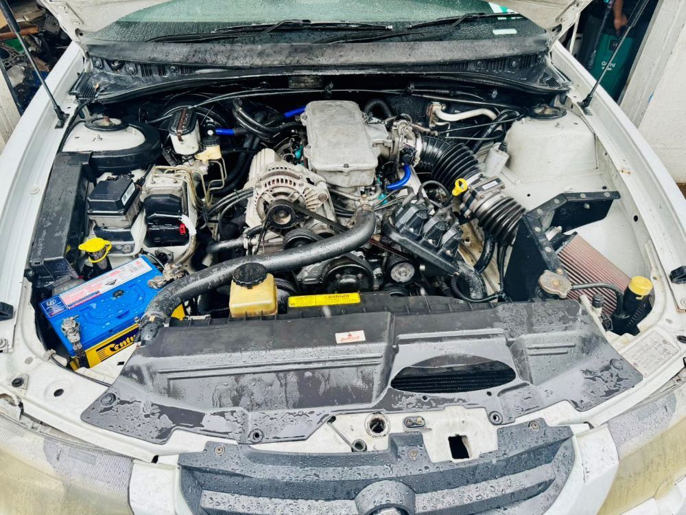 A White Car Engine Bay With a Detailed — Wellers Automotive & Performance in Hervey Bay, QLD