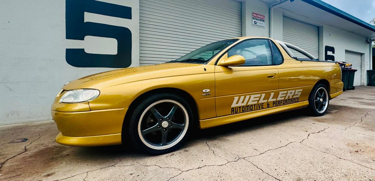 A Gold Car is Parked — Wellers Automotive & Performance in Hervey Bay, QLD