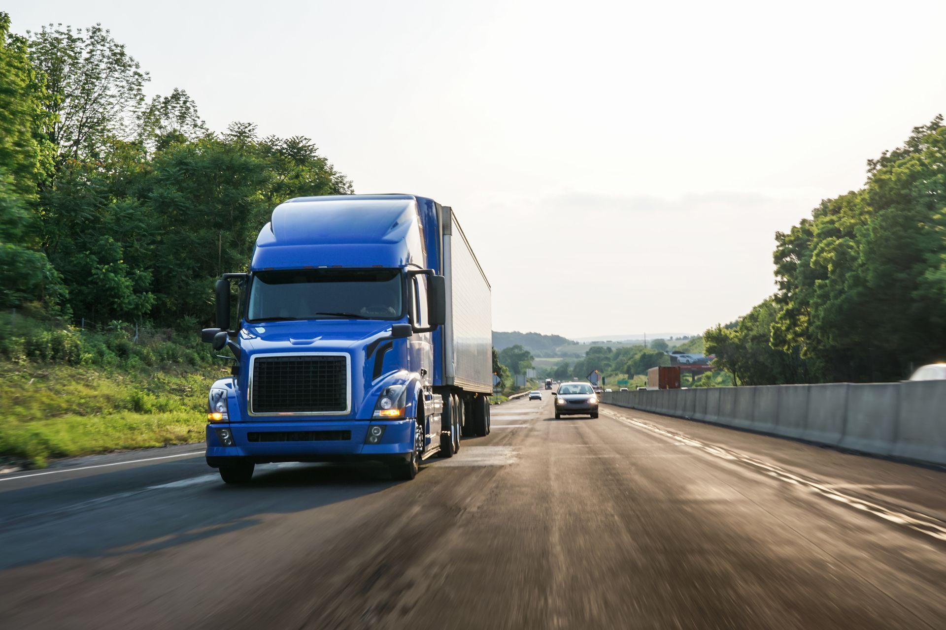 A blue Trailer For Rent on a road