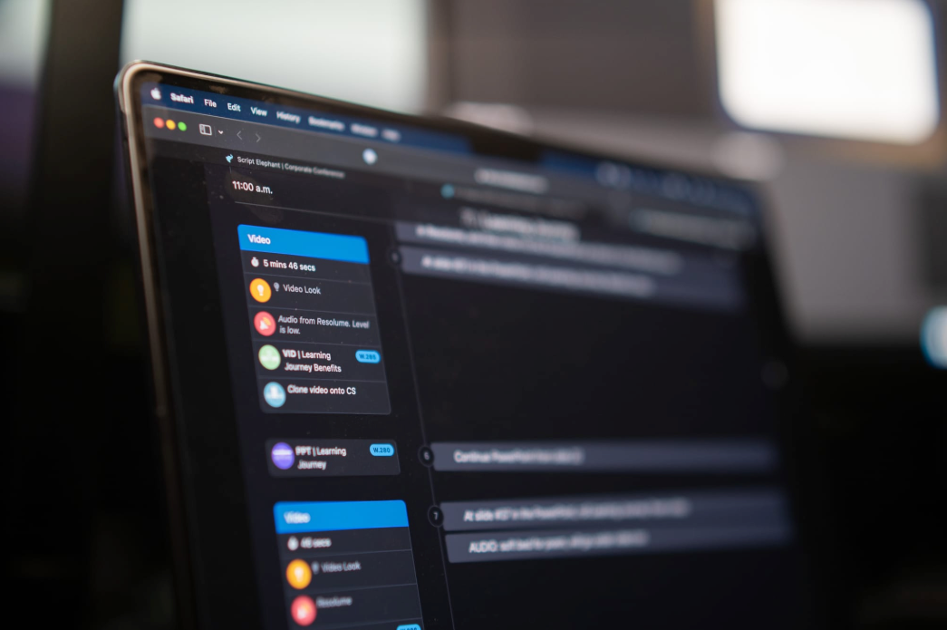 Laptop screen displaying a chat application with multiple active chats; dark mode interface.