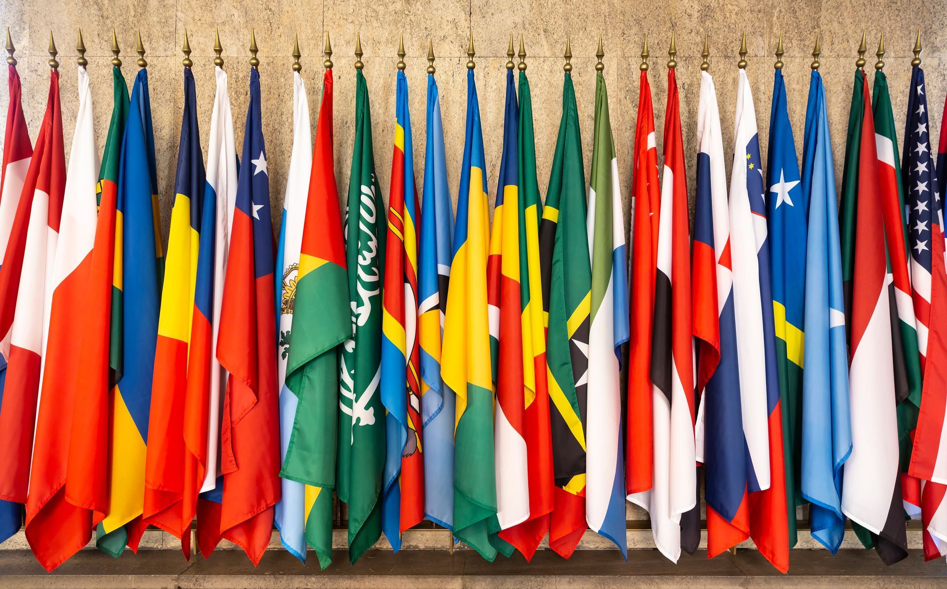 Multiple international flags displayed in a row.