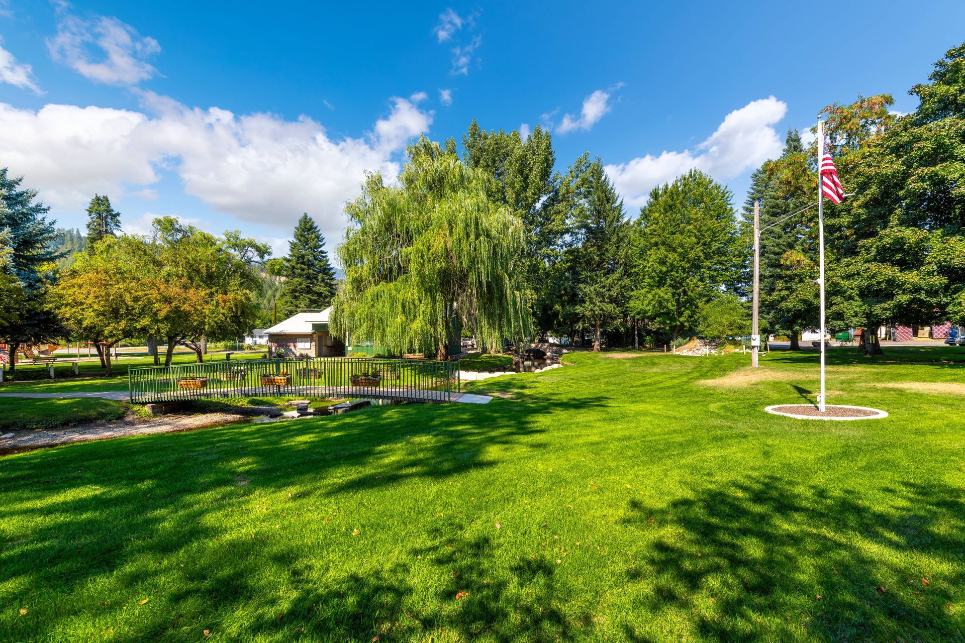 A park with a flagpole.