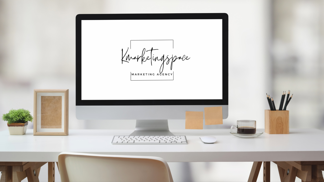 A computer is sitting on a desk next to a chair.