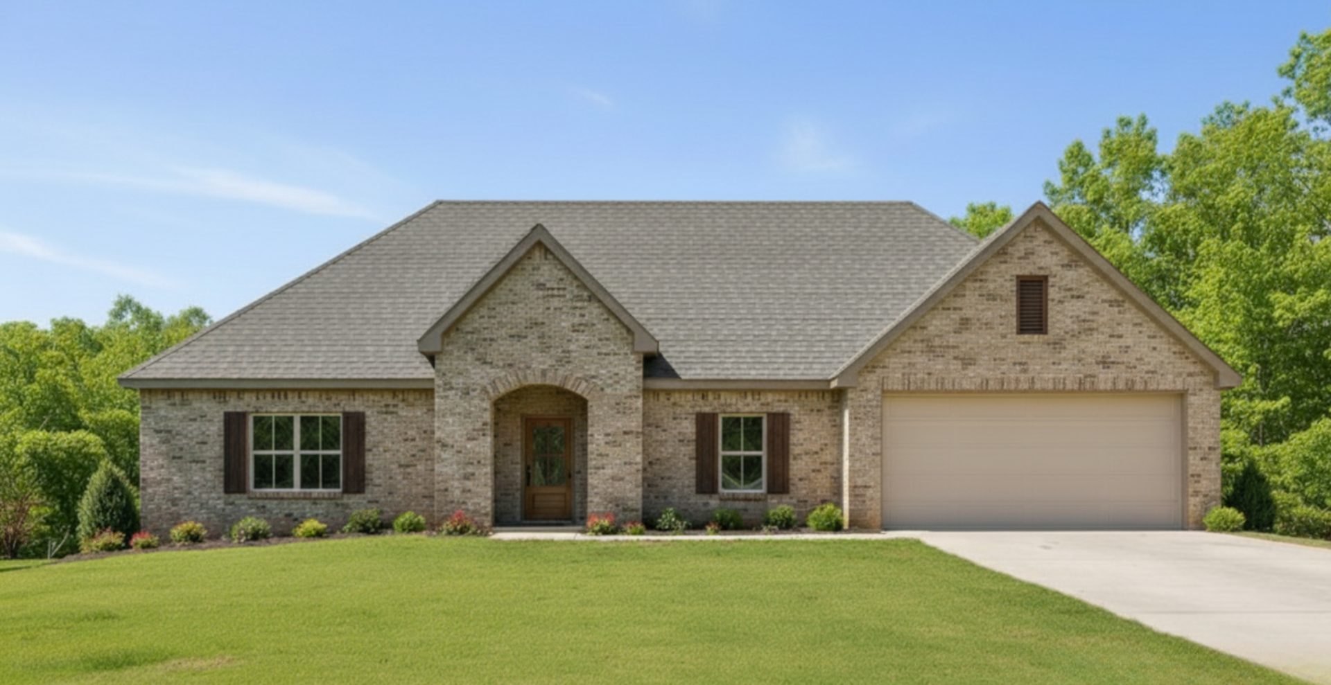 Simple custom home built by hines homes with dark brick and a white accent wall out front with a curved front porch