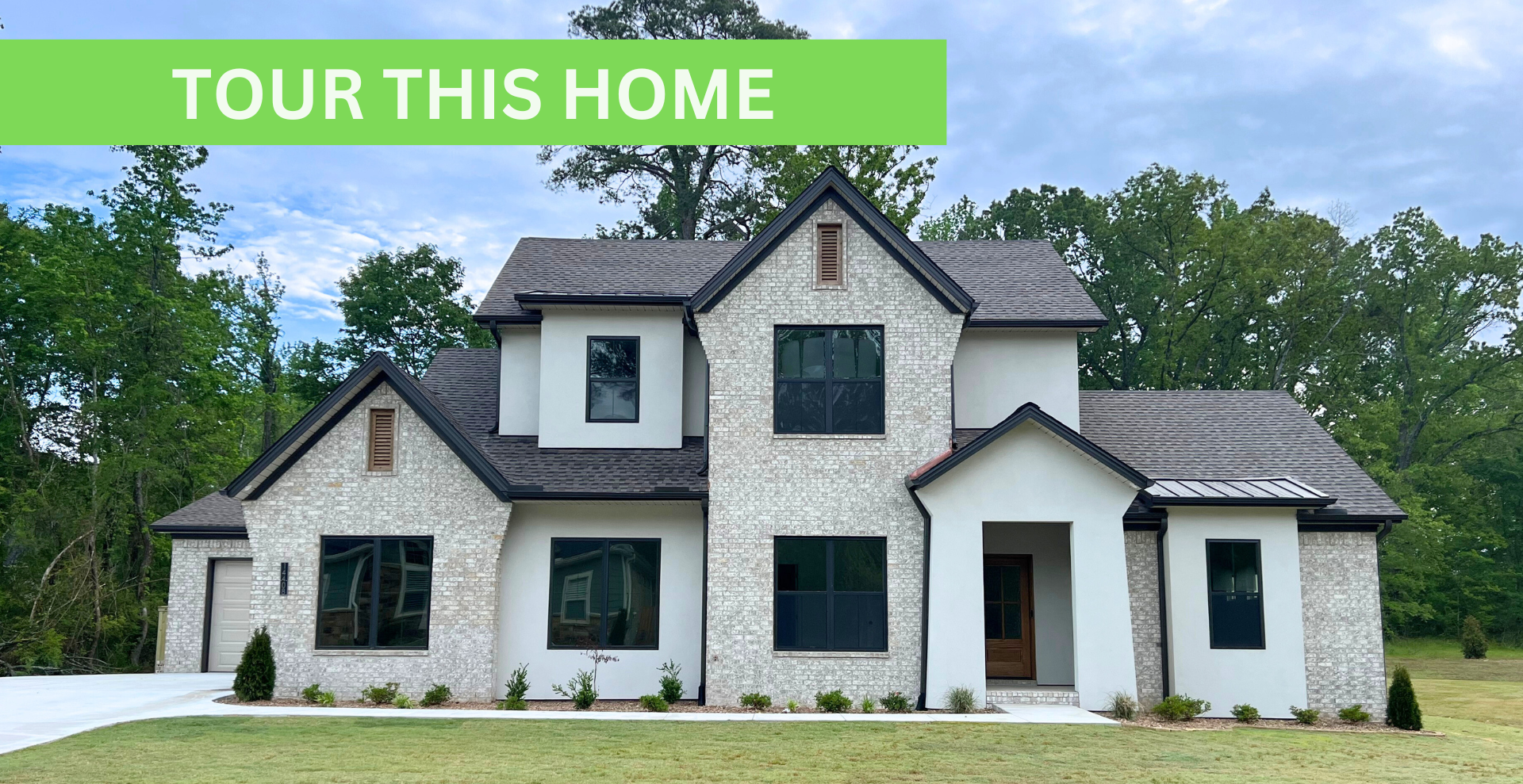 new construction home that is two story and lighter exterior colors. full of windows for natural light
