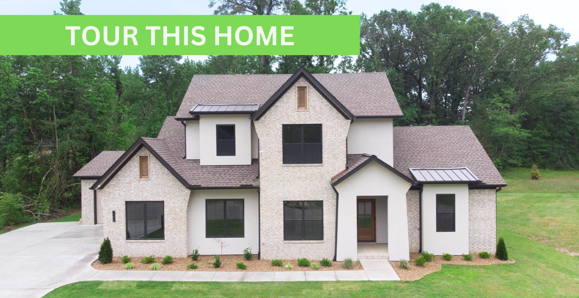 new construction home that is two story and lighter exterior colors. full of windows for natural light