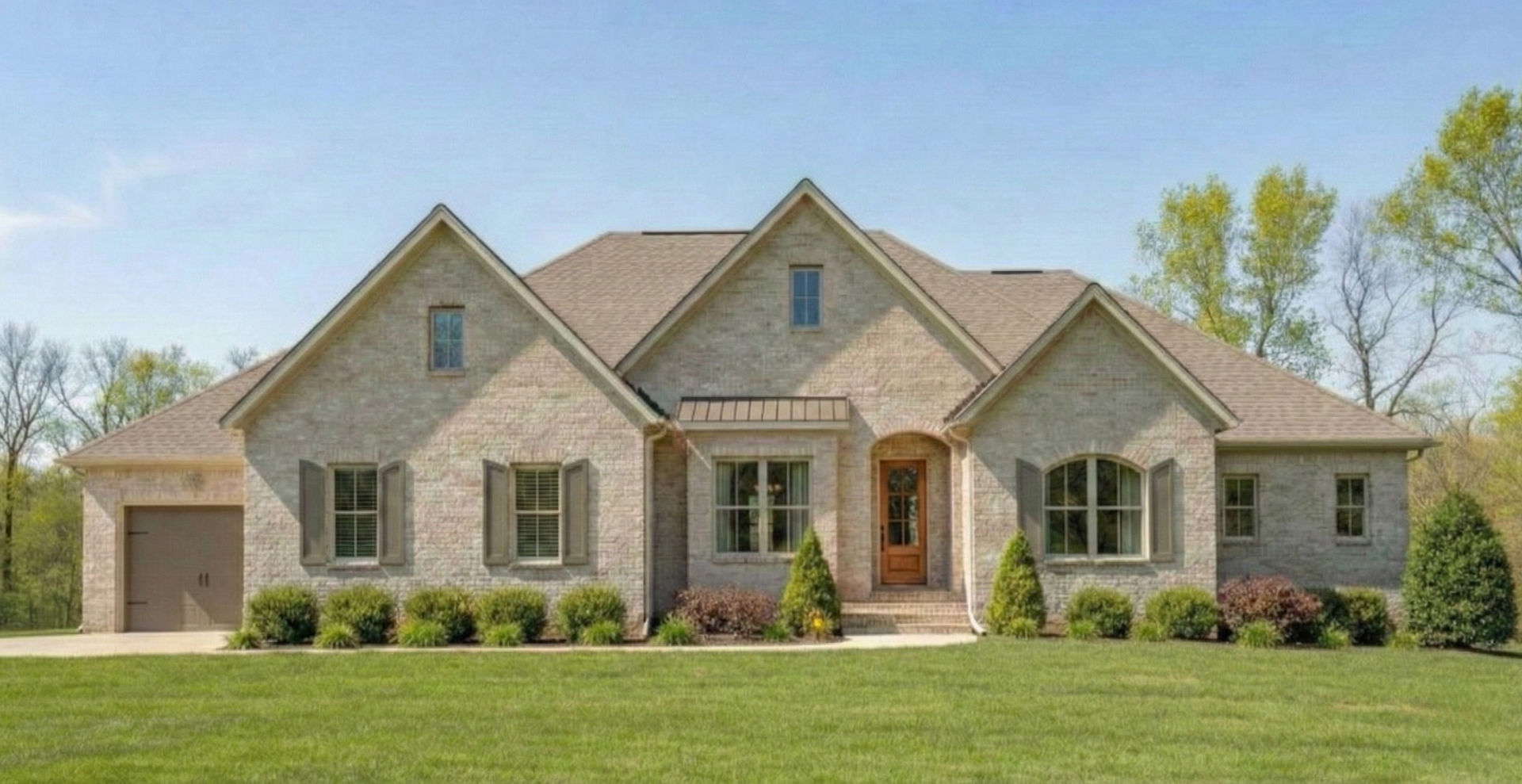 new construction home that is two story and lighter exterior colors. full of windows for natural light