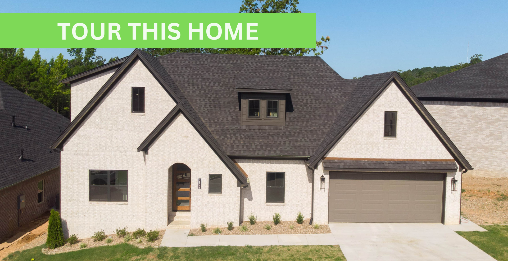 new construction home that is two story and lighter exterior colors. full of windows for natural light