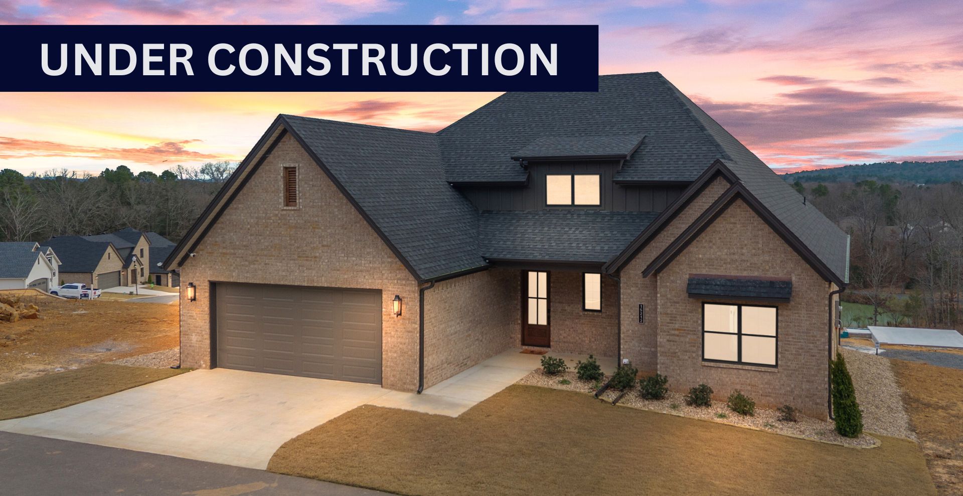 new construction home that is two story and lighter exterior colors. full of windows for natural light
