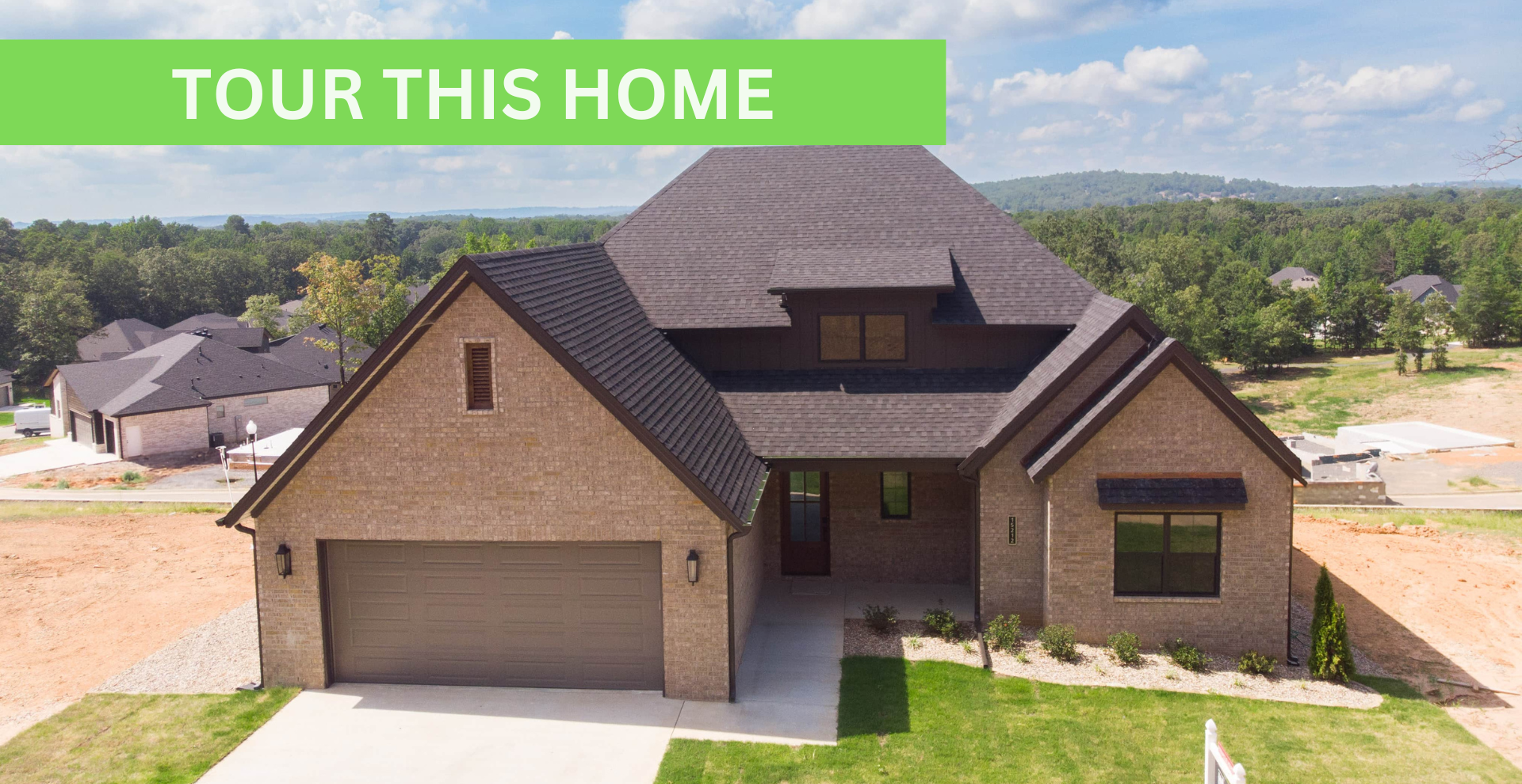 new construction home that is two story and lighter exterior colors. full of windows for natural light