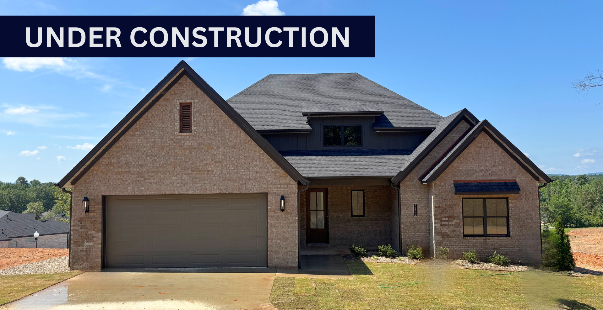 new construction home that is two story and lighter exterior colors. full of windows for natural light