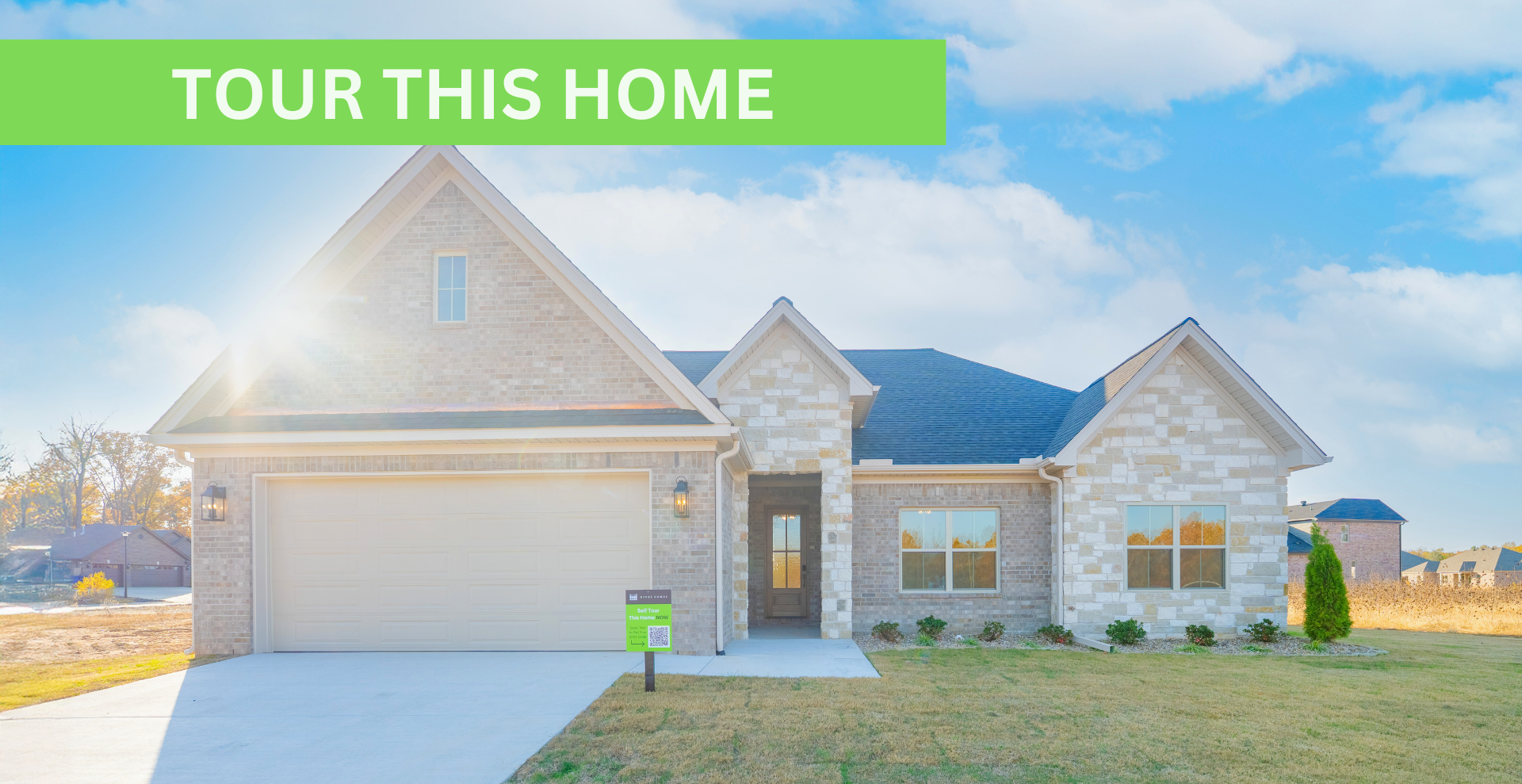Simple custom home built by hines homes with dark brick and a white accent wall out front with a curved front porch
