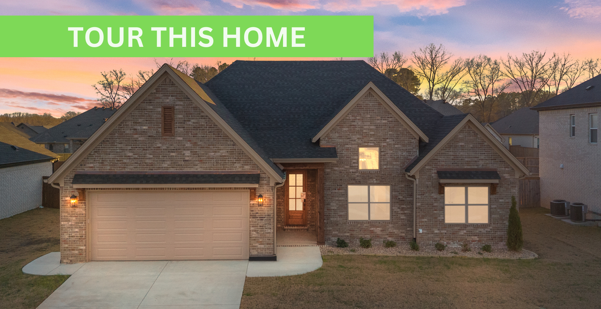 Simple custom home built by hines homes with dark brick and a white accent wall out front with a curved front porch