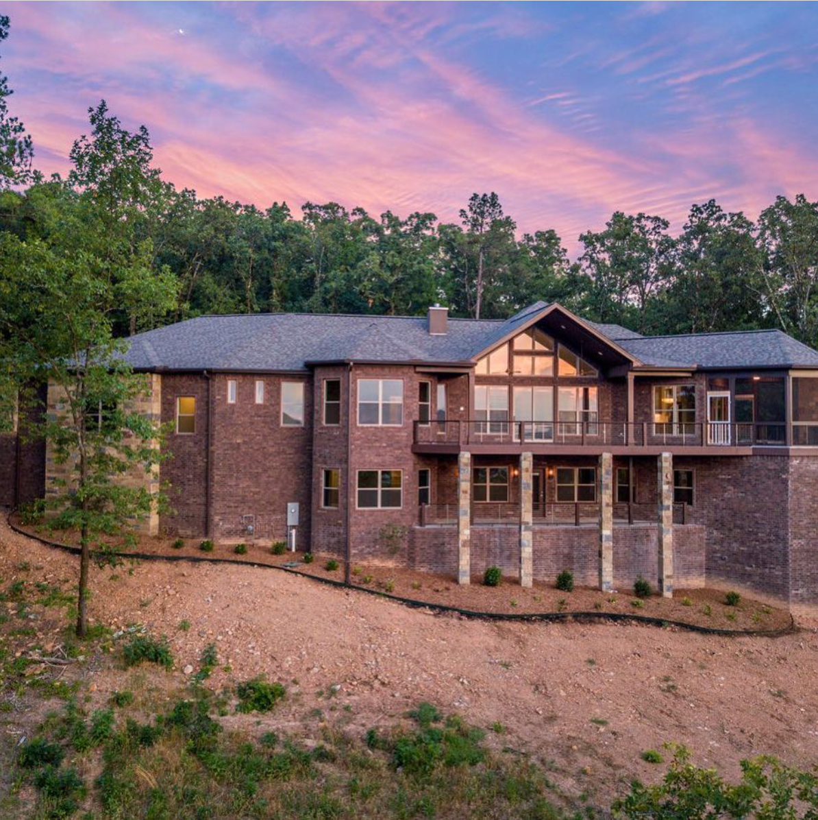 View of a modern new construction home built by hines homes with double deck, two story, lots of windows for natural light
