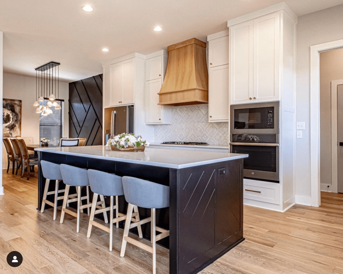 open floor plan kitchen with an island that has seating, built by hines homes