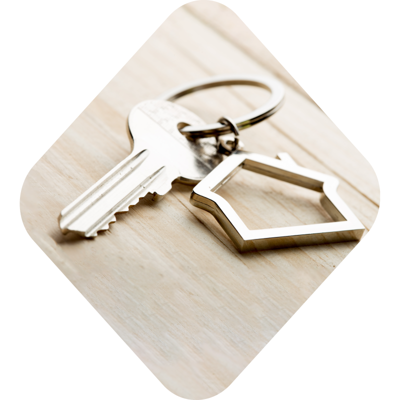 Photo of keys with a house keychain, all encapsulated in a diamond shape