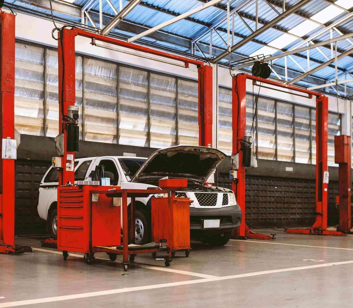 A Car Is Sitting On A Lift In A Garage — Valley Brake & Clutch In McDougalls Hill, NSW