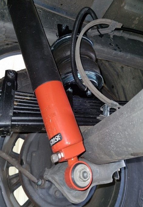 A Close Up Of The Underside Of A Car With A Tyre And Shock Absorber — Valley Brake & Clutch In Mcdougalls Hill, NSW