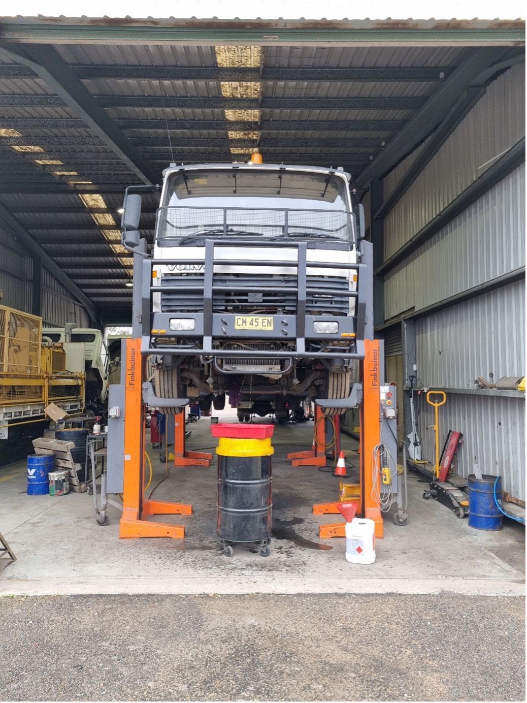 A Man Is Working On The Engine Of A Car — Valley Brake & Clutch In McDougalls Hill, NSW