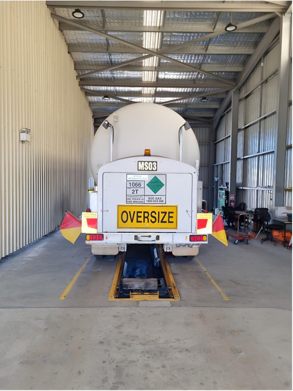 A White Truck With a Yellow Sign on the Back That Says 'Oversized' — Valley Brake & Clutch In McDougalls Hill, NSW