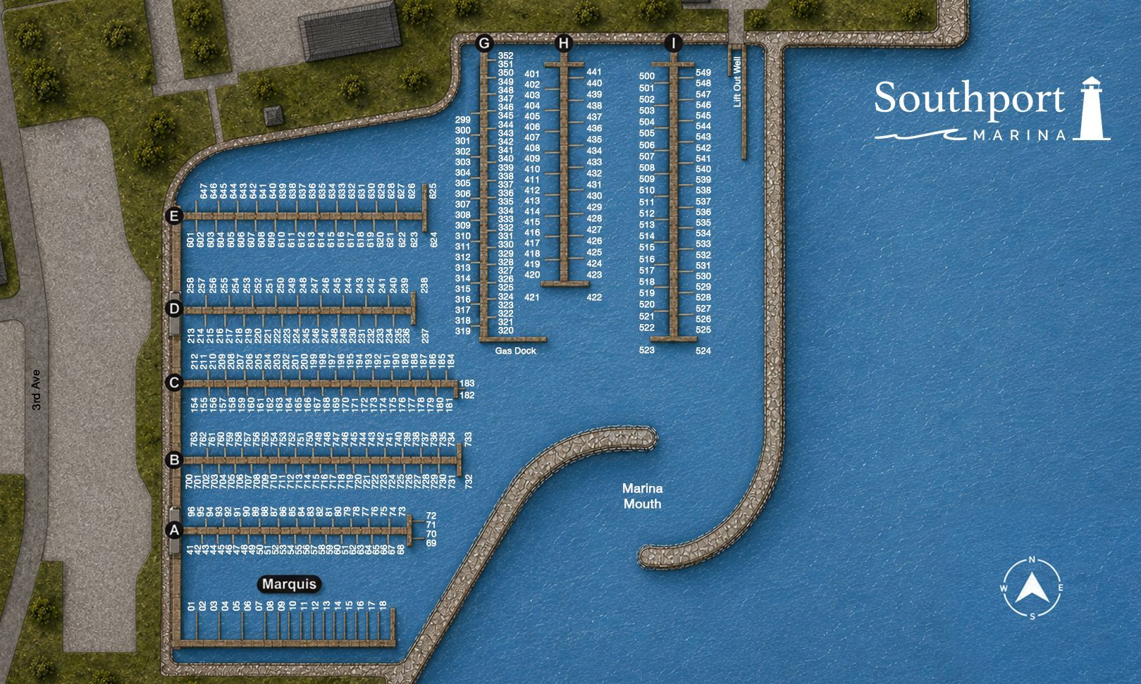 Aerial view of a blue marina with many docks and boats beside land and the Southport sign