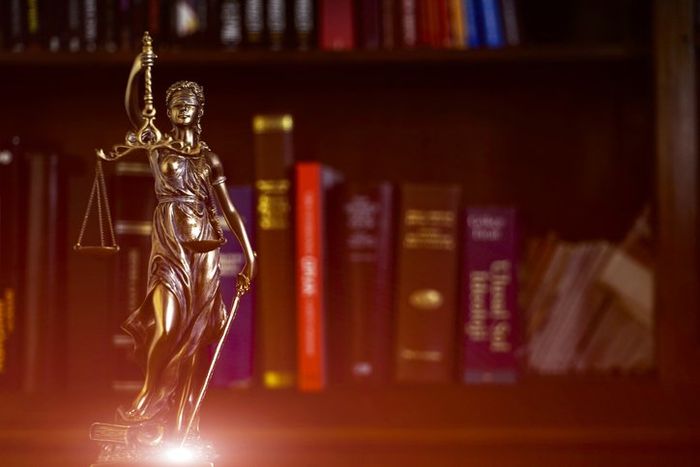 Lawyer Holding Law Books and Judge Gavel — Clarkston, WA — Gittins & Dukes PLLC