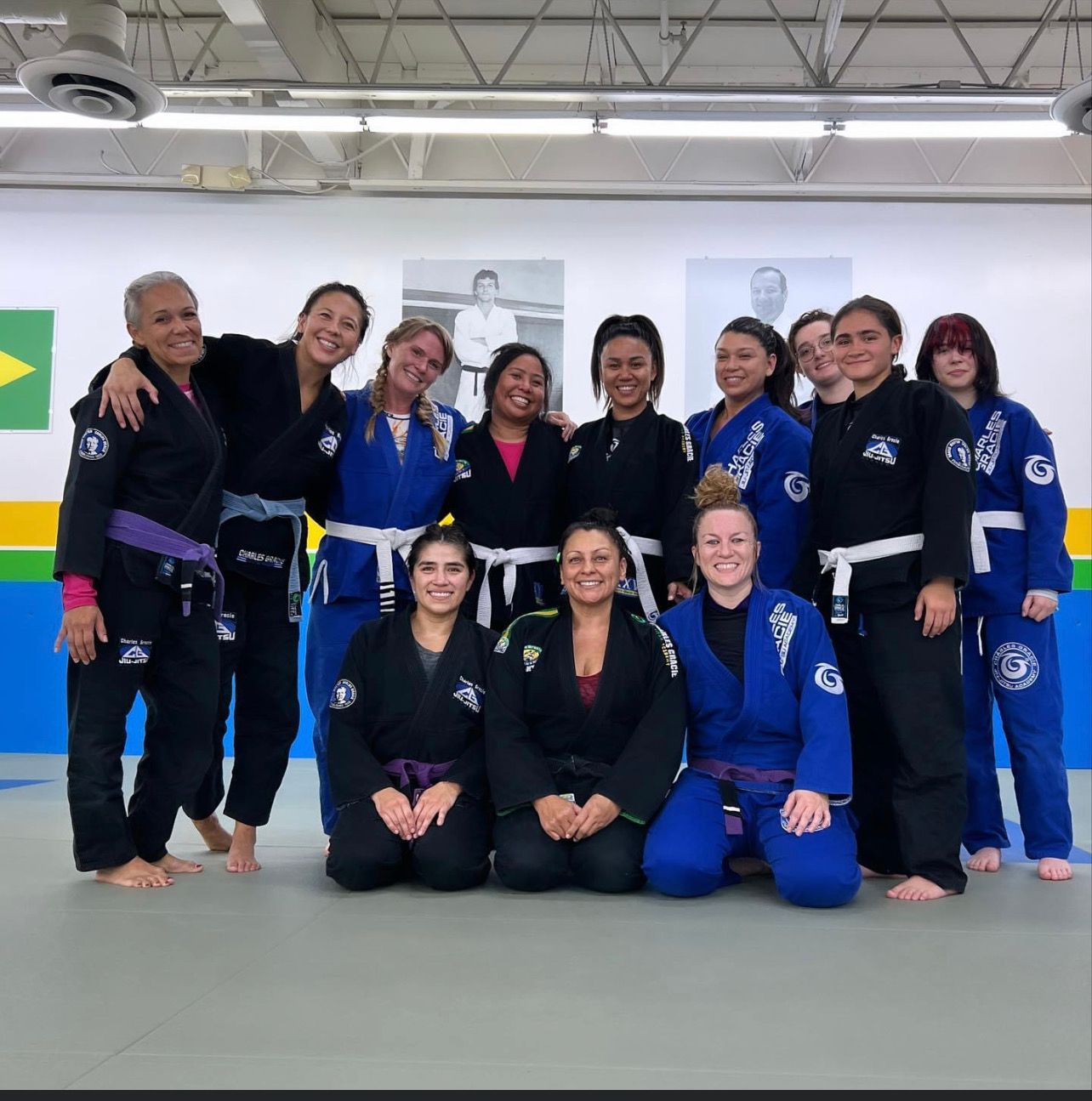 A group of women posing for a picture in a gym