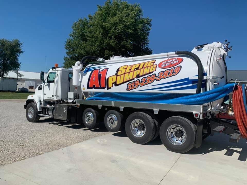 a man wearing a shirt that says ' drain cleaning ' on it