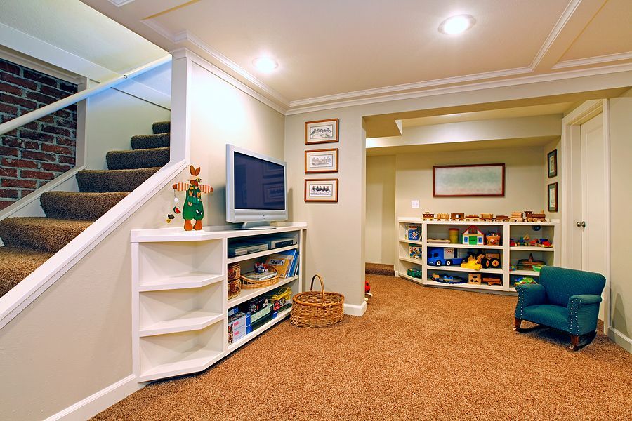 A basement with stairs leading up to the second floor