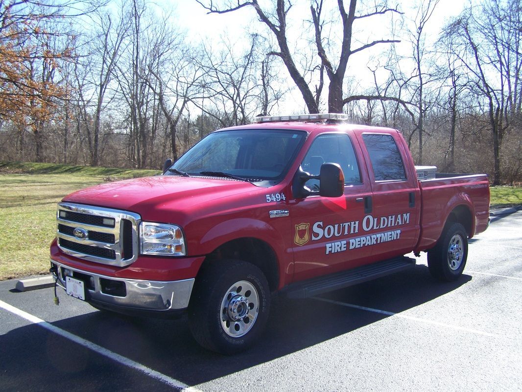 A red truck with the word south on it