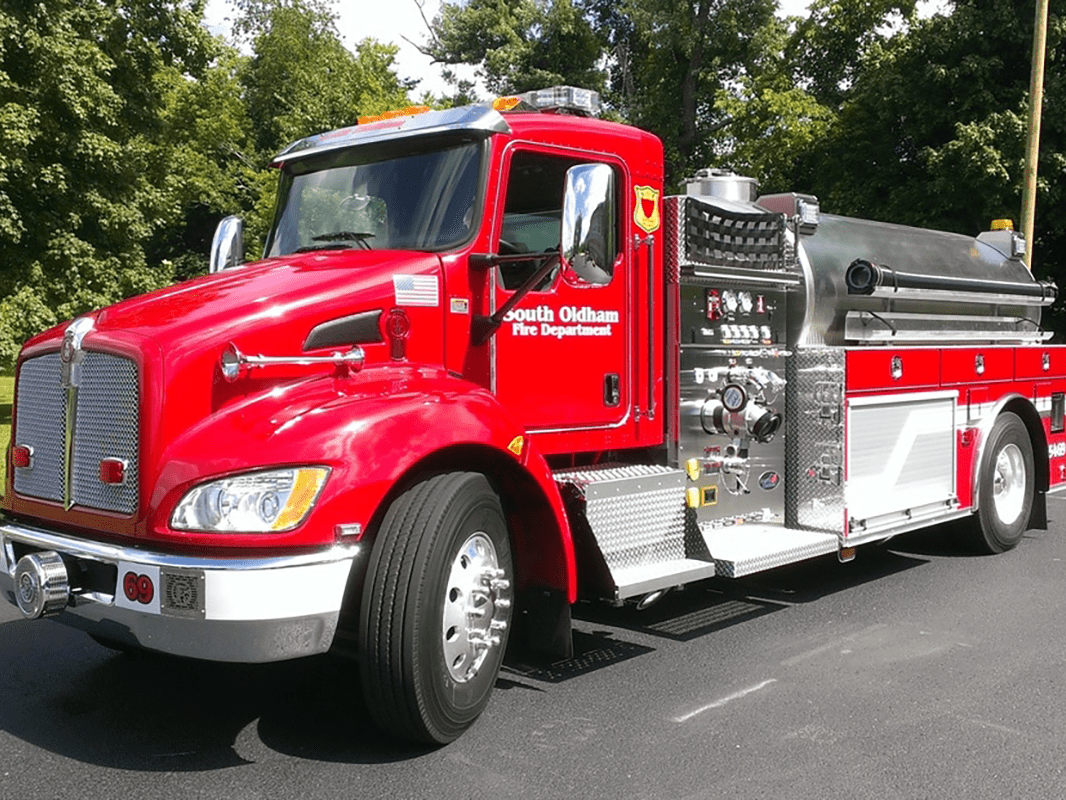 A red fire truck is parked on the side of the road