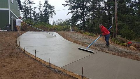 Foundations — Man Installing Driveway  in Manchester, WA