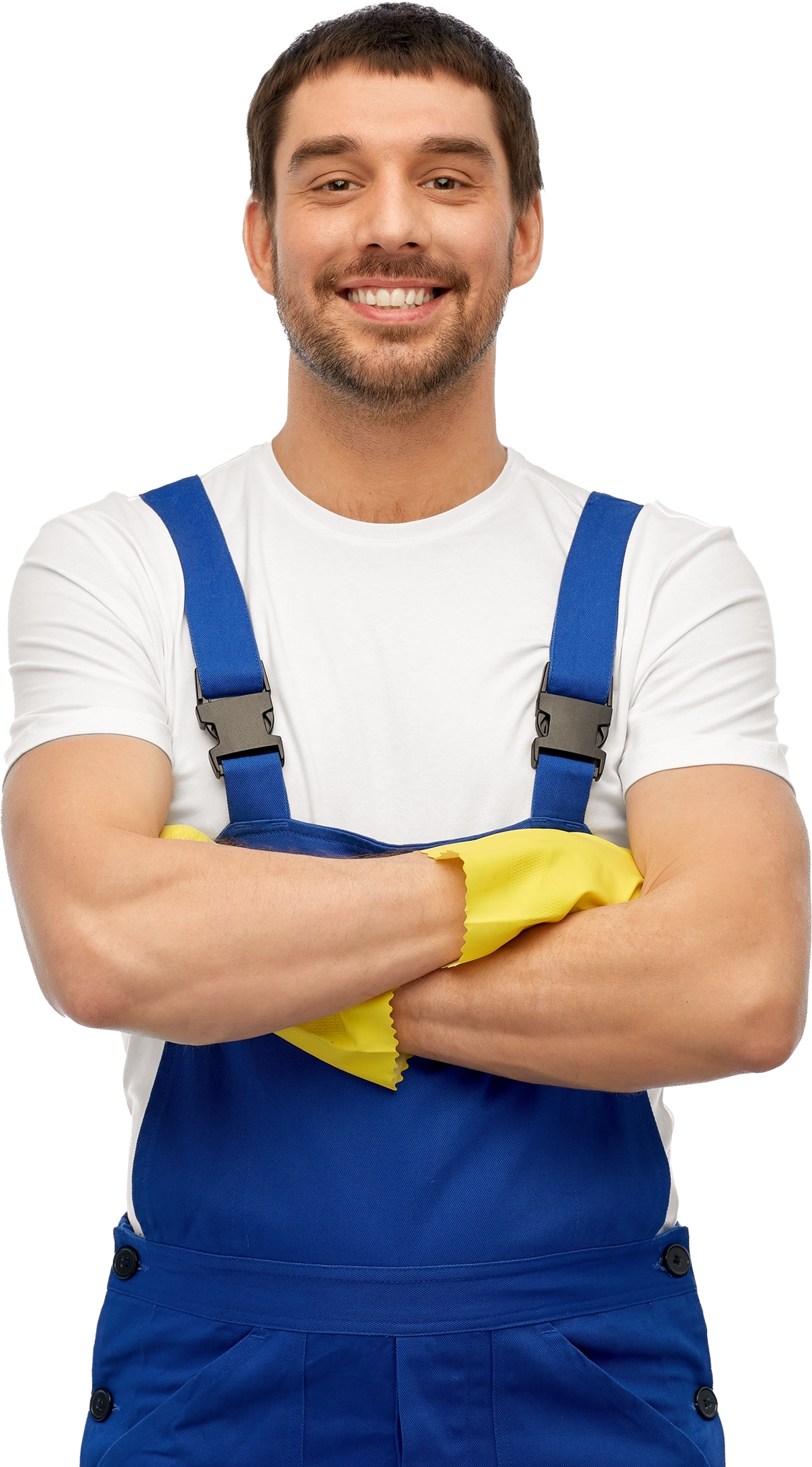 A man in blue overalls and yellow gloves is smiling with his arms crossed.