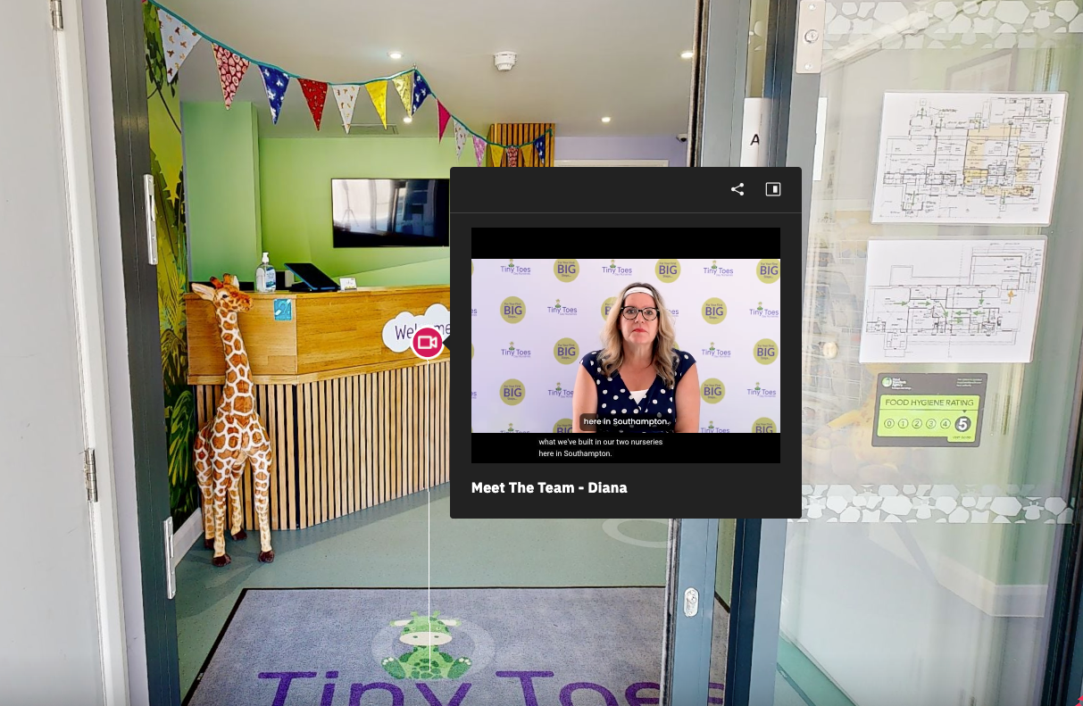 A baby is sitting upside down on a white chair.